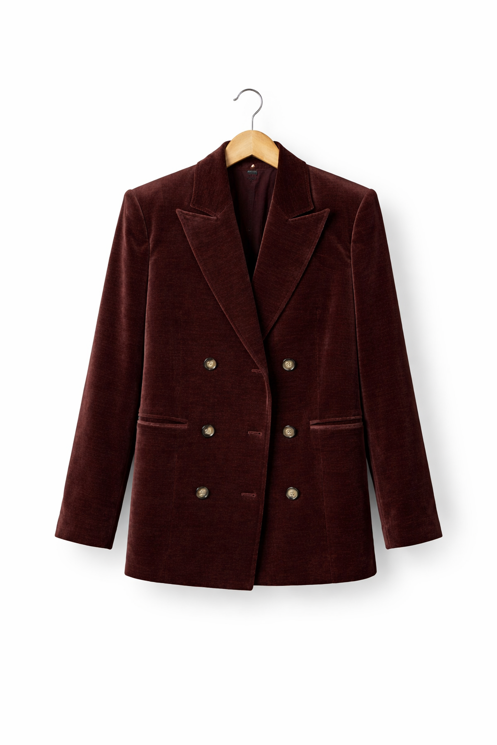 Aksamitna damska kurtka zapinana na guziki, o strukturalnym kroju