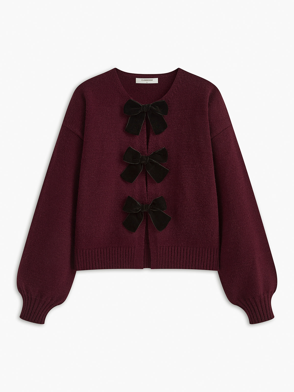 Sweter z dzianiny z ozdobną kokardką